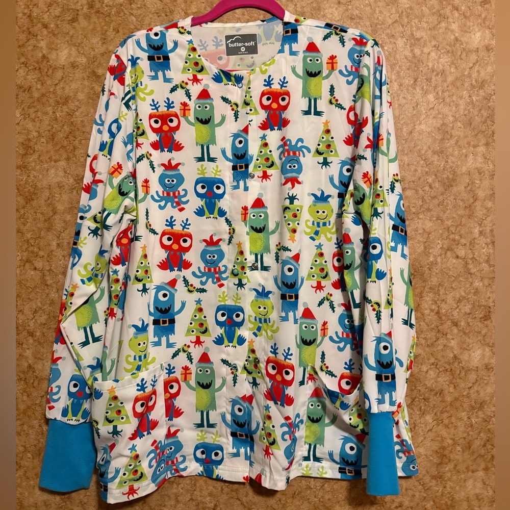 Butter-Soft White Christmas Scrub jacket with Blue, Green, Red Accents